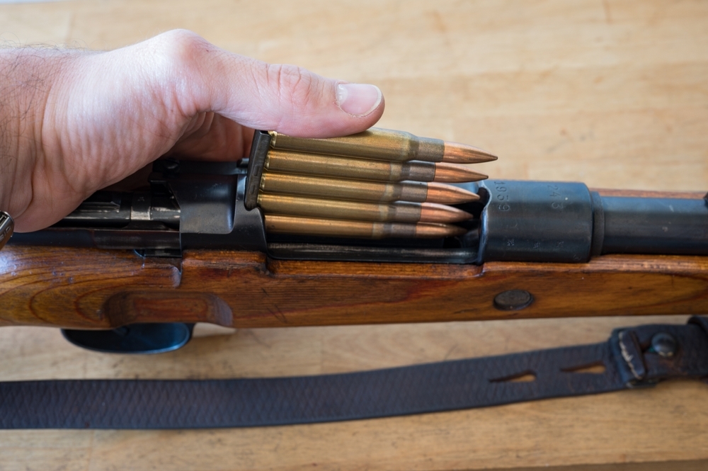 Image of M1 garand being loaded 30-06