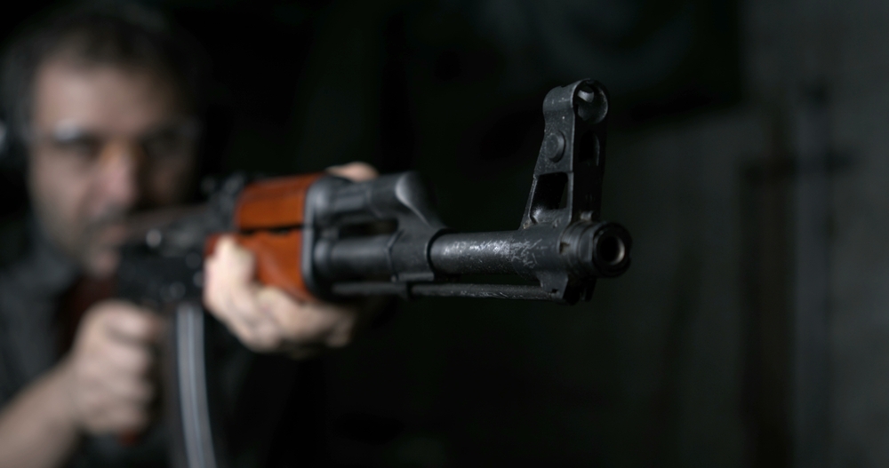 Close-up of AK-47 Rifle shooting in high-speed 800 fps. Firing Kalashnikov weapon in slow-motion