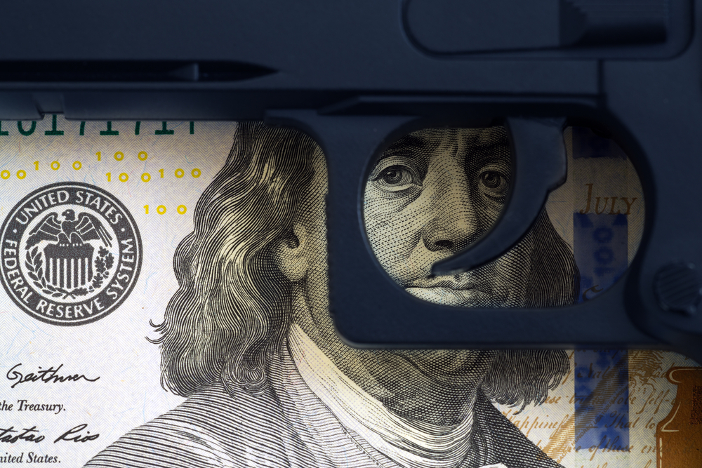 $100 bill behind Trigger