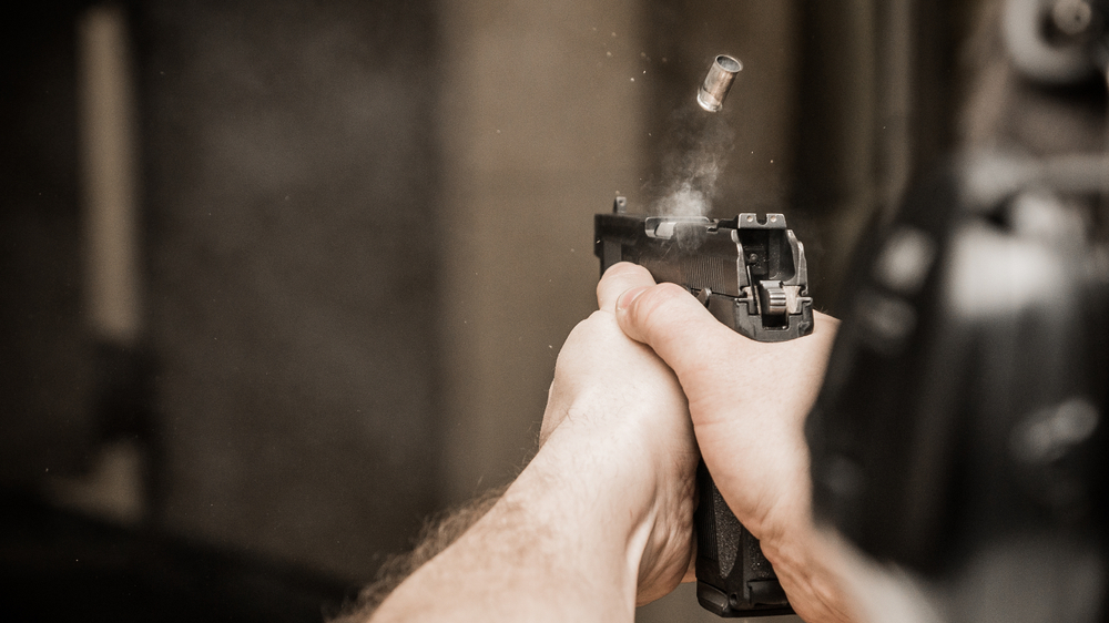Man firing at indoor range