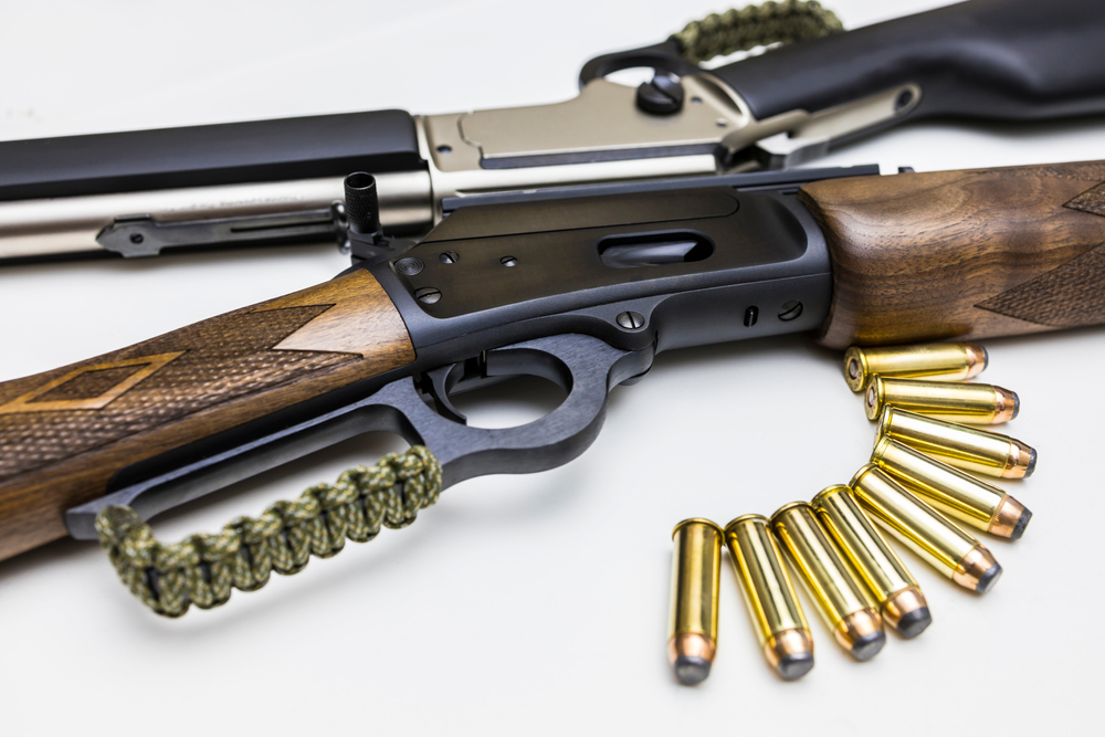 two lever actions sitting on a table