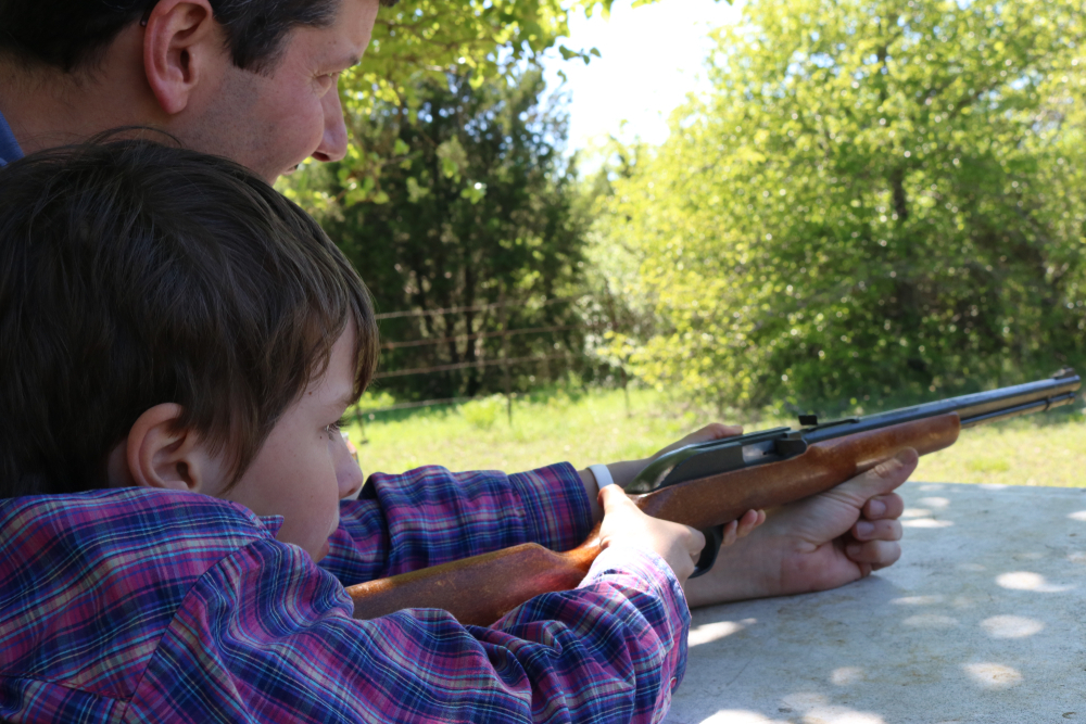 Parent teaching Child to shoot 22 LR Rifle