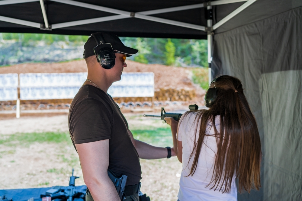 Trainer Instructing Student on Range
