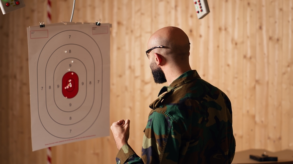 Man at Range Checking Target